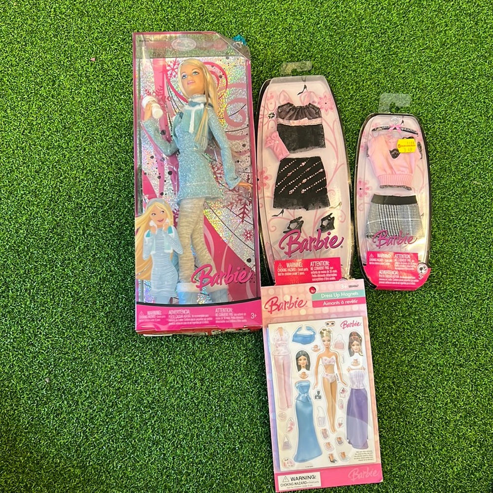 Barbie and outfits plus magnet set! Older never used!